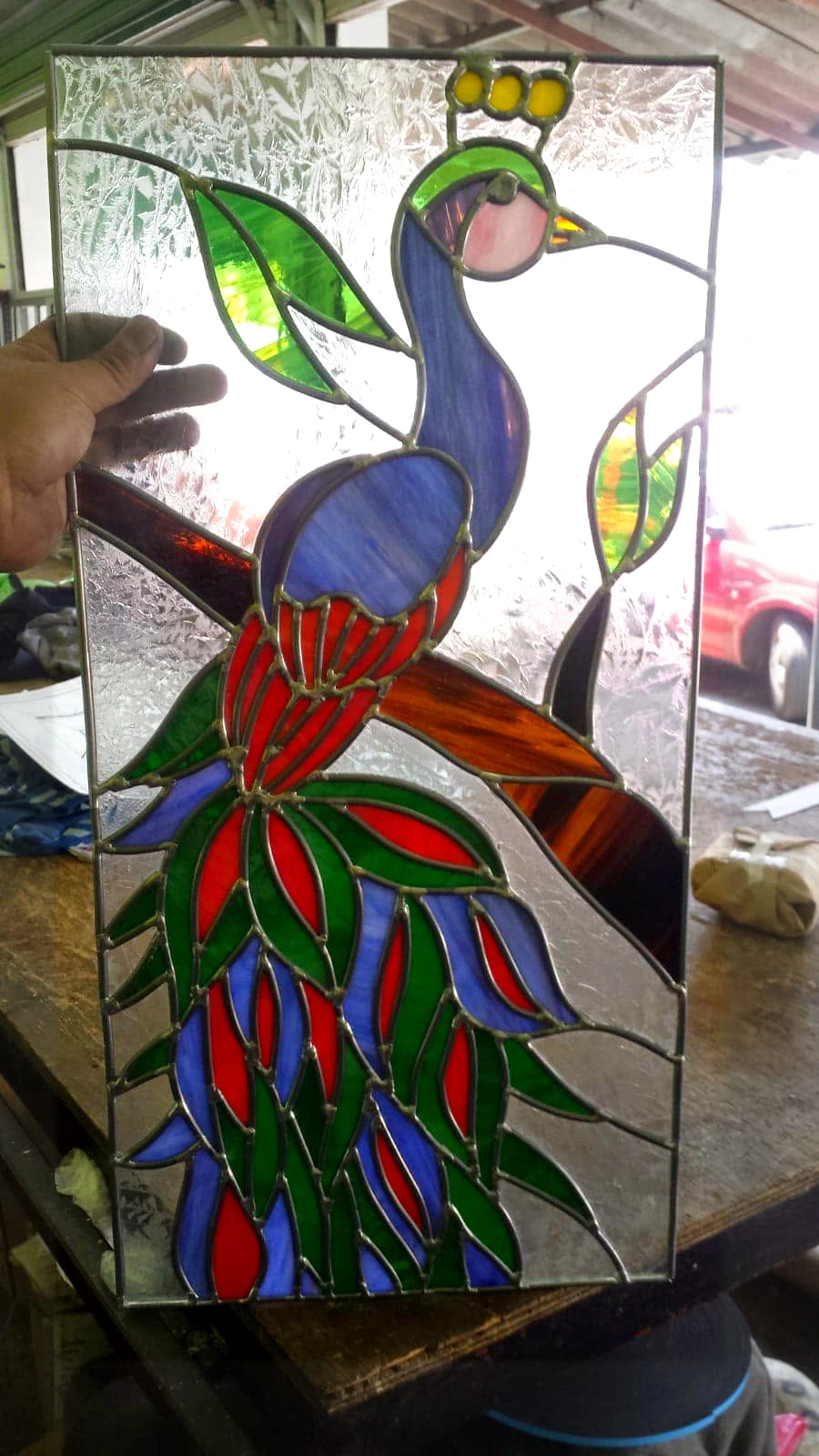 Vitral de un pavo real